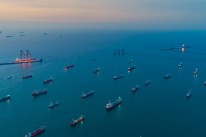 Ships moored at sea at sunset - aerial view